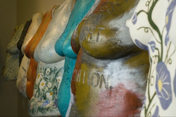 Row of Beautiful Women Project sculptures